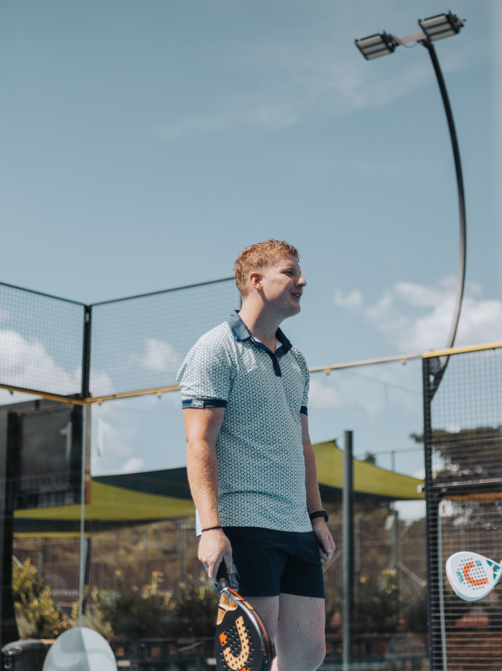 Male padel player standing ready position during match at Padel Spring Festival